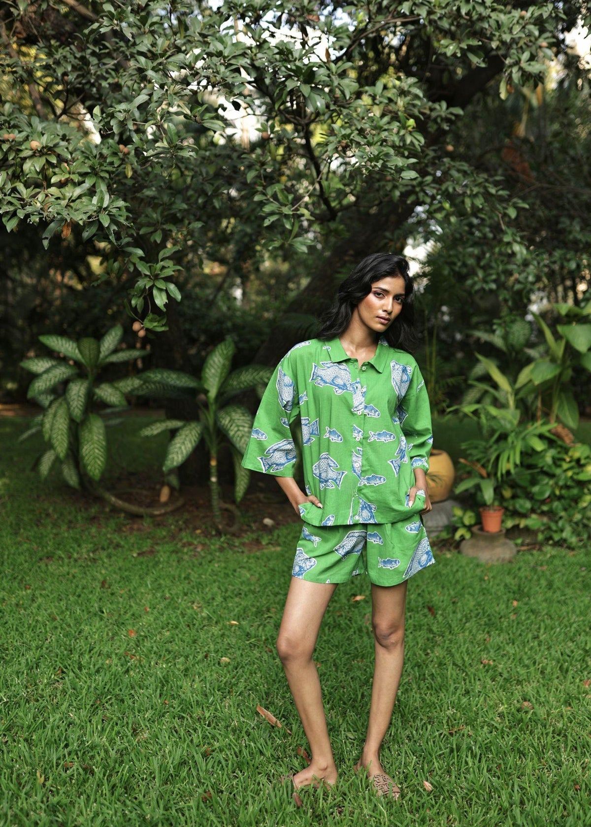 Woman wearing Azurina Green Fish Two Fish print cotton shorts set, luxury resortwear