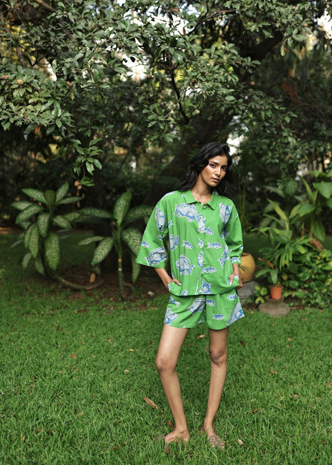 Woman wearing Azurina Green Fish Two Fish print cotton shorts set, luxury resortwear