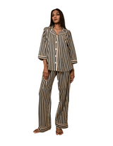 Woman wearing Black Satori print button-down pajama set with beige piping, premium cotton sleepwear