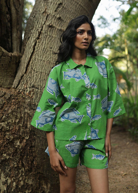 Woman wearing Azurina Green Fish Two Fish print cotton shorts set, luxury resortwear