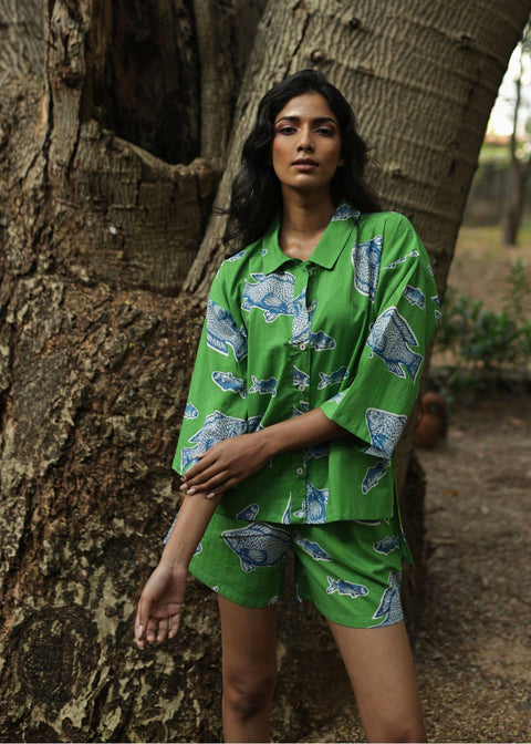 Woman wearing Azurina Green Fish Two Fish print cotton shorts set, luxury resortwear